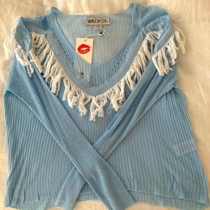 Brand new wildfox light blue sweater with fringe. Never worn. Tags attached.